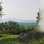 Steam from thermal water and view to Tuscany
