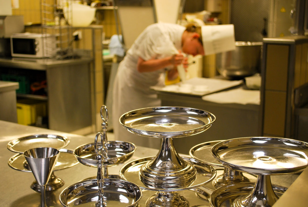 cook preparing merengue at hotel kitchen